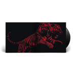 A vinyl record partially pulled from its sleeve, showing a black-and-red graphic of two roaring tigers on the cover against a white background.